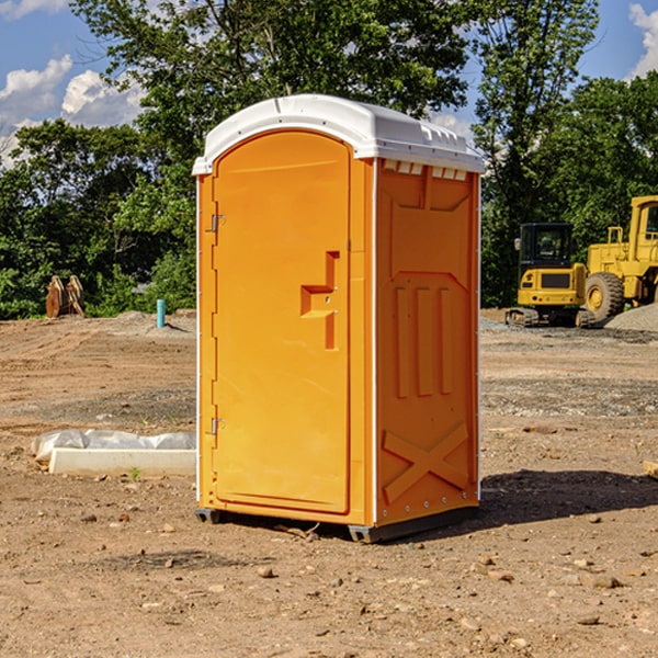 what is the cost difference between standard and deluxe portable toilet rentals in Hinton